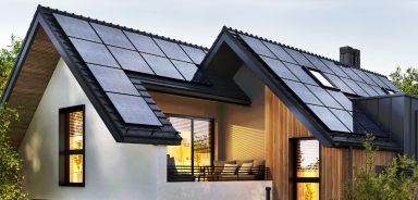 A residential home with solar panels on the roof.
