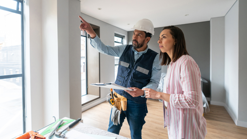 A woman is consulting with a contractor.